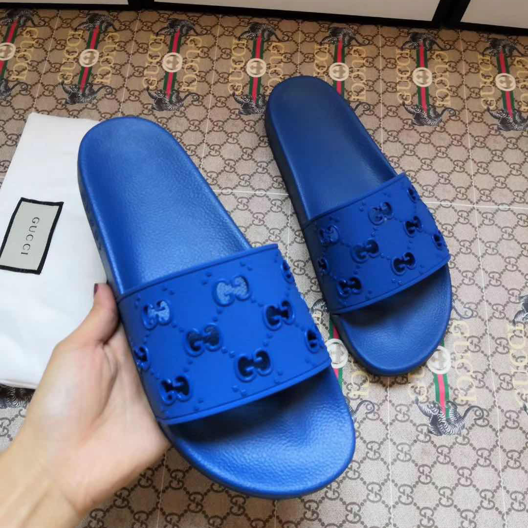 Gucci Rubber GG Slide Sandal In Blue - FashionPlug
