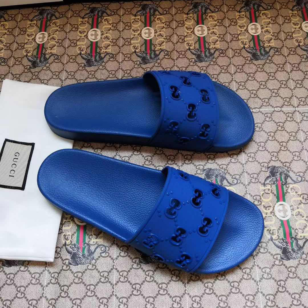 Gucci Rubber GG Slide Sandal In Blue - FashionPlug