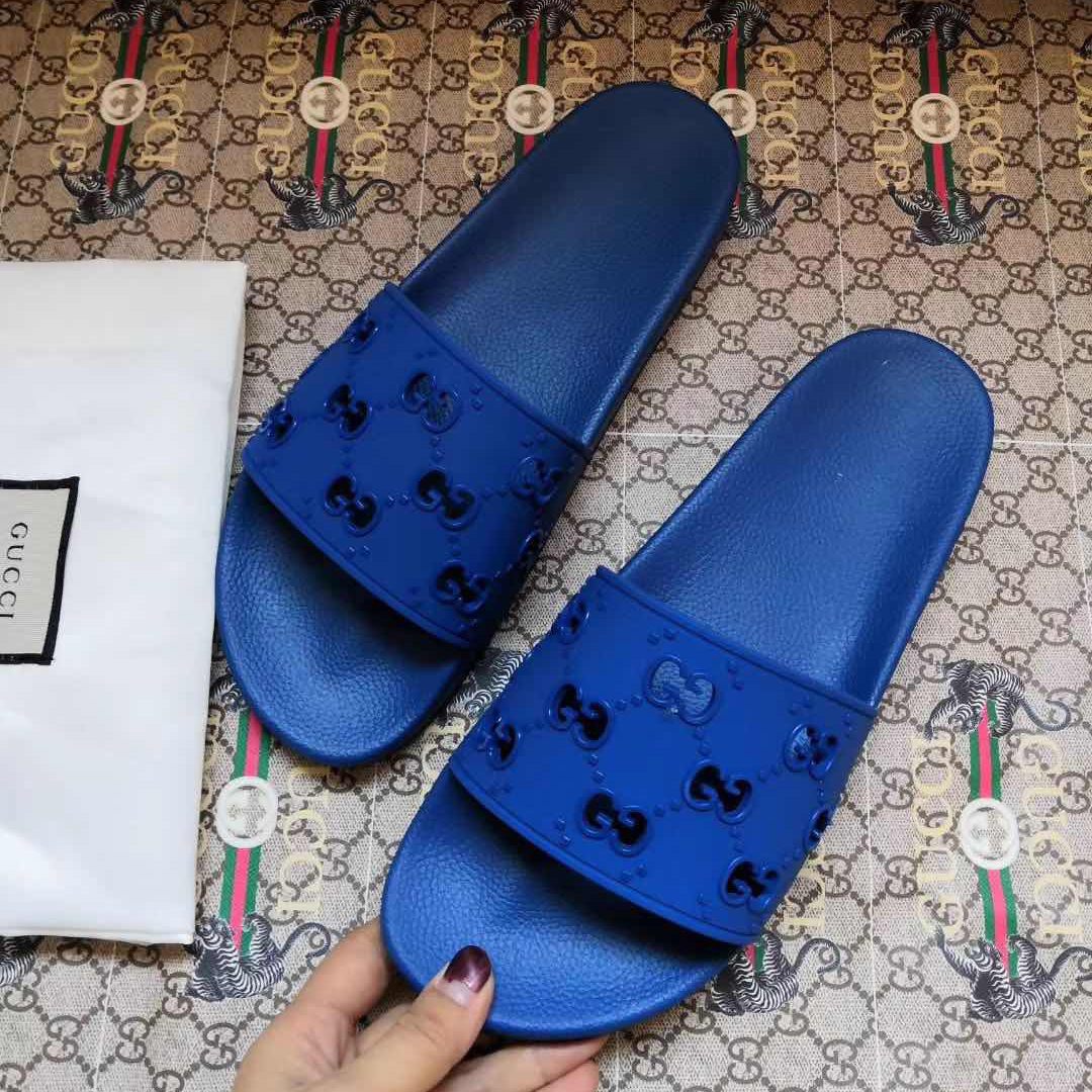 Gucci Rubber GG Slide Sandal In Blue - FashionPlug