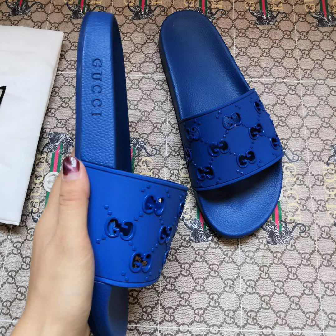 Gucci Rubber GG Slide Sandal In Blue - FashionPlug