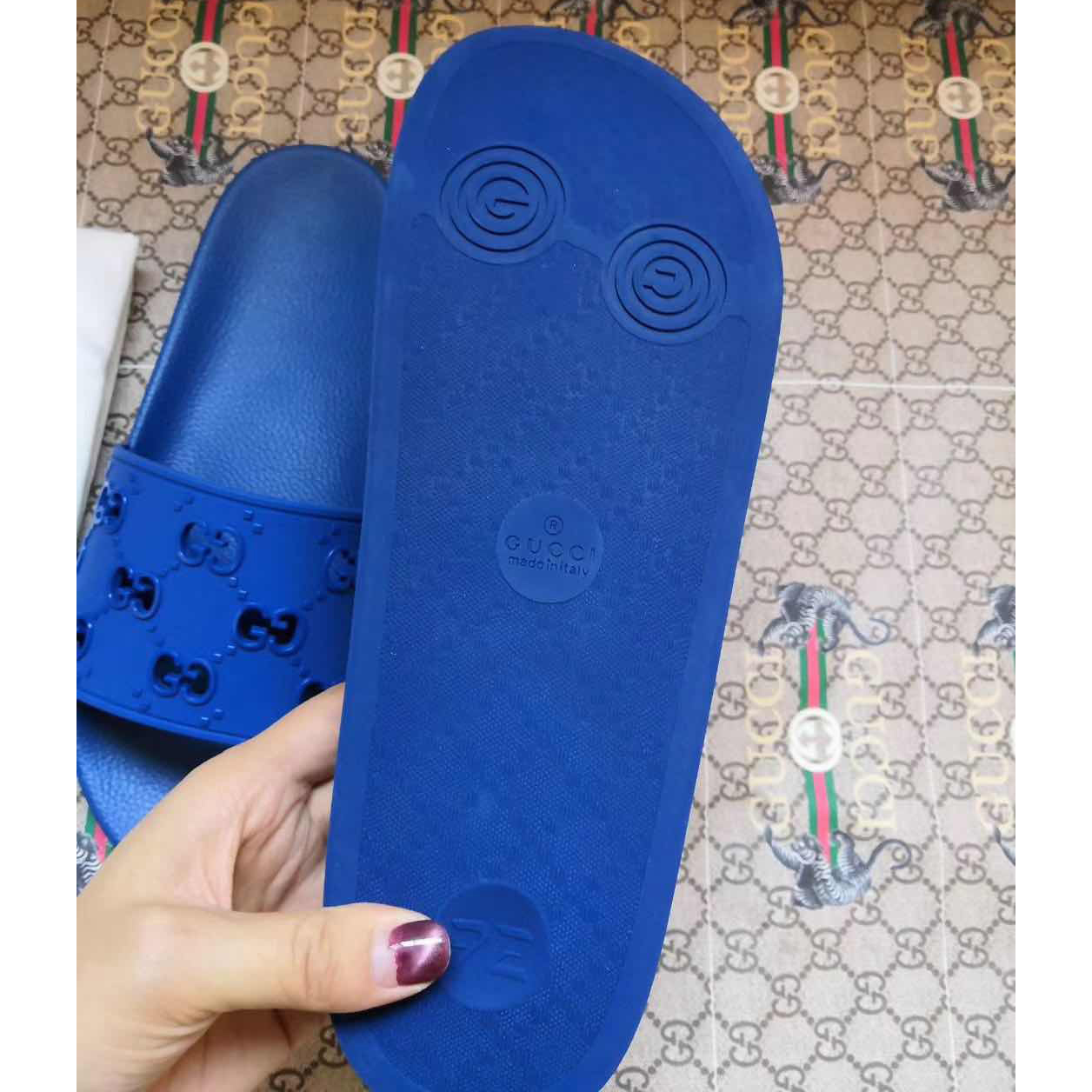 Gucci Rubber GG Slide Sandal In Blue - FashionPlug