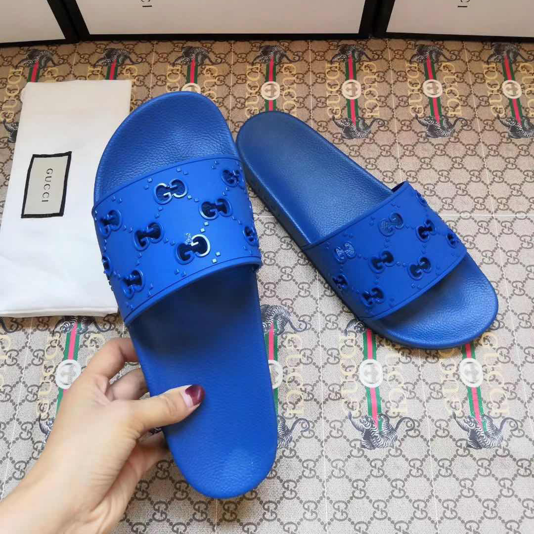 Gucci Rubber GG Slide Sandal In Blue - FashionPlug