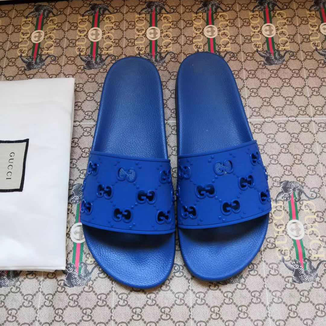 Gucci Rubber GG Slide Sandal In Blue - FashionPlug