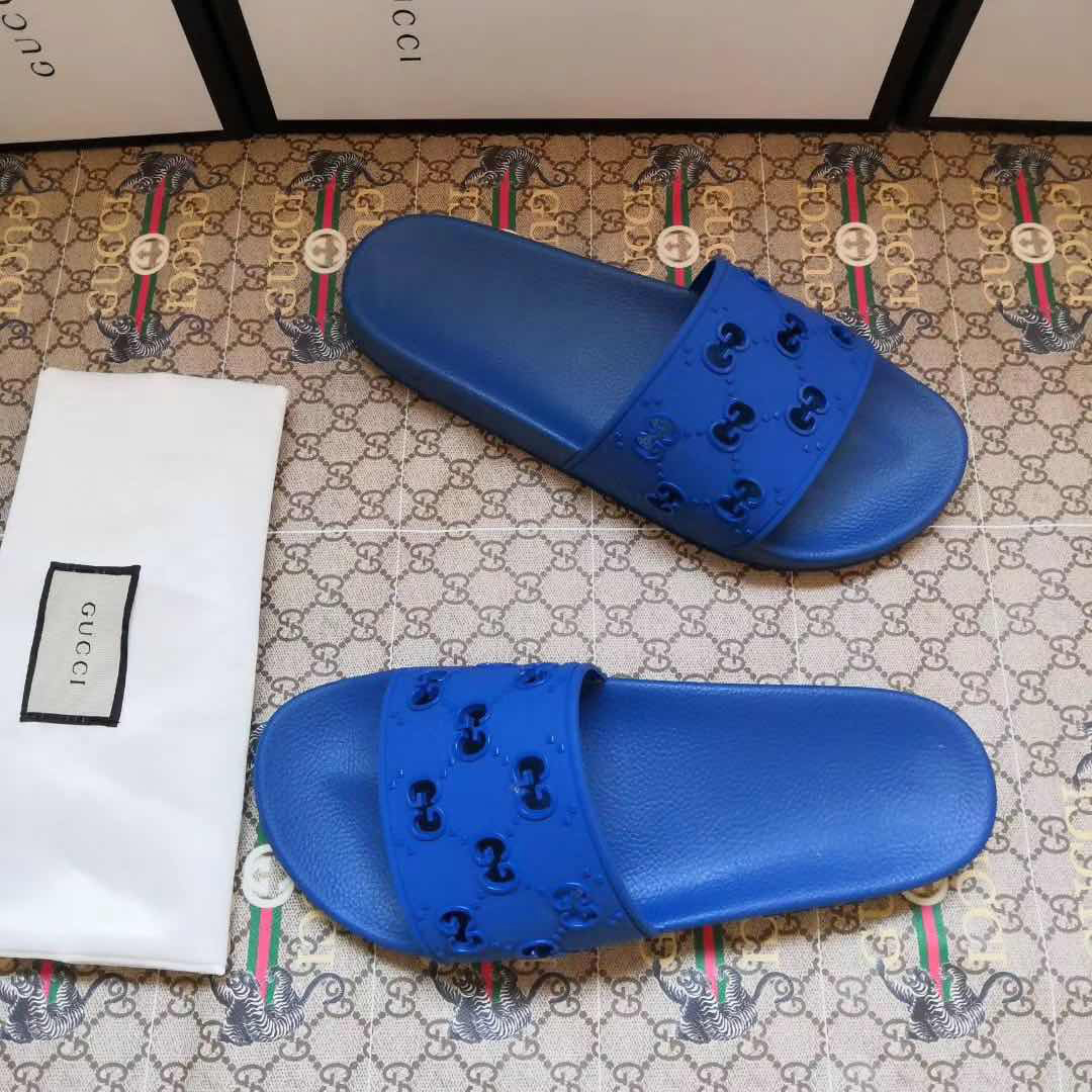 Gucci Rubber GG Slide Sandal In Blue - FashionPlug