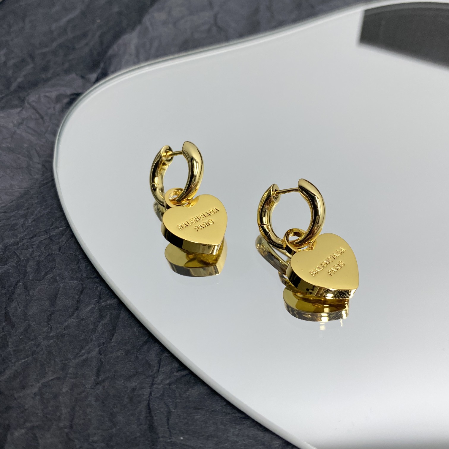 Balenciaga  Engraved Heart Earrings - FashionPlug