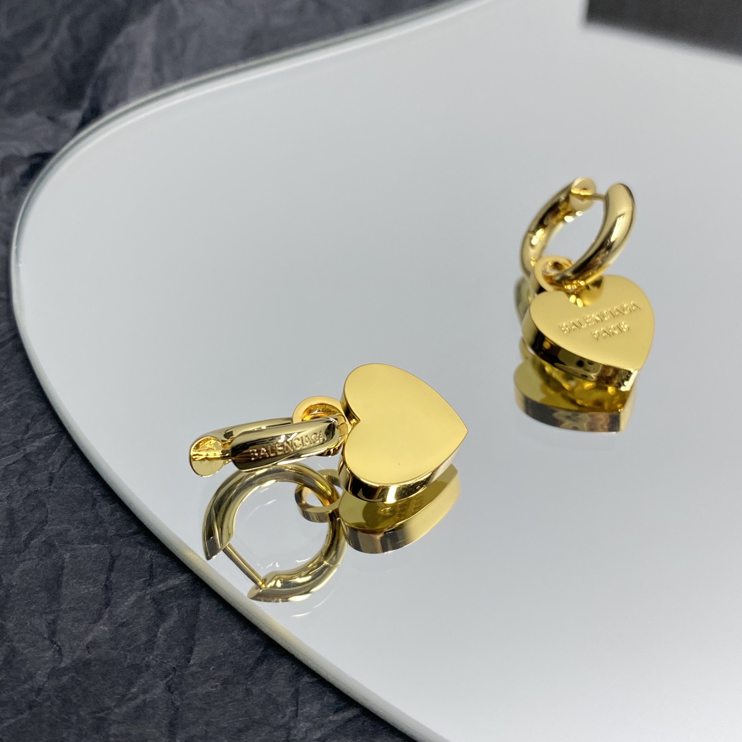 Balenciaga  Engraved Heart Earrings - FashionPlug
