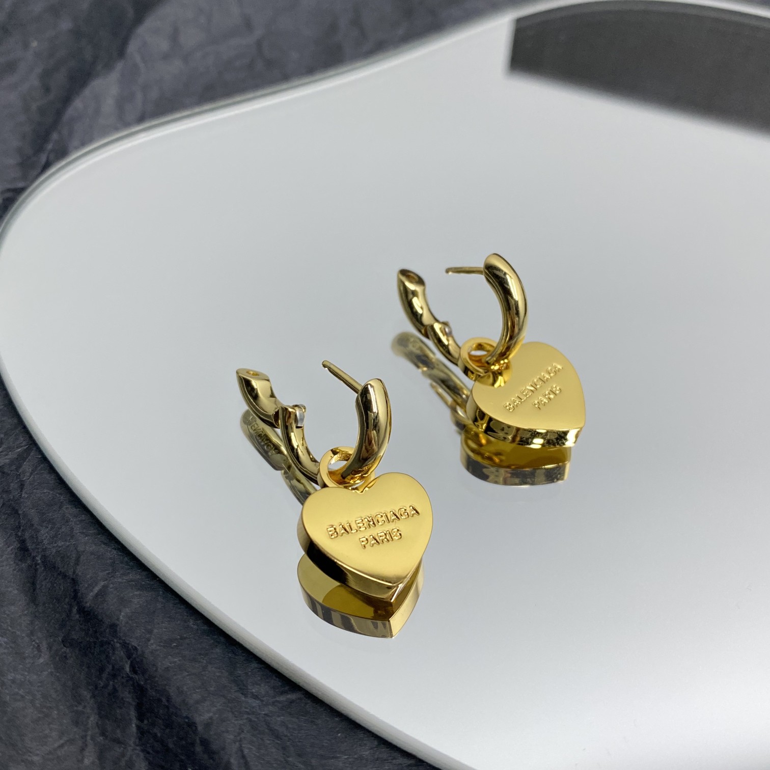 Balenciaga  Engraved Heart Earrings - FashionPlug