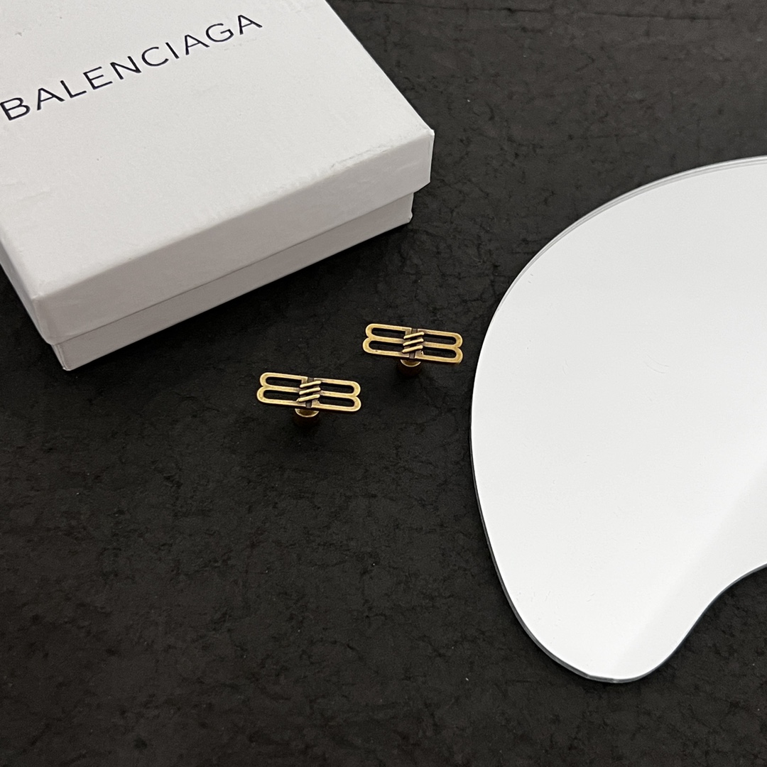 Balenciaga BB Icon Earrings In Aged-Gold Brass - FashionPlug