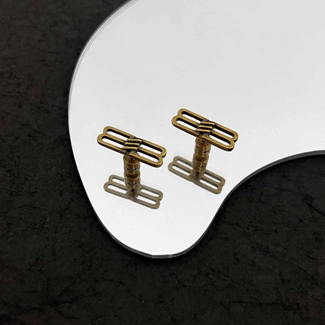 Balenciaga BB Icon Earrings In Aged-Gold Brass - FashionPlug