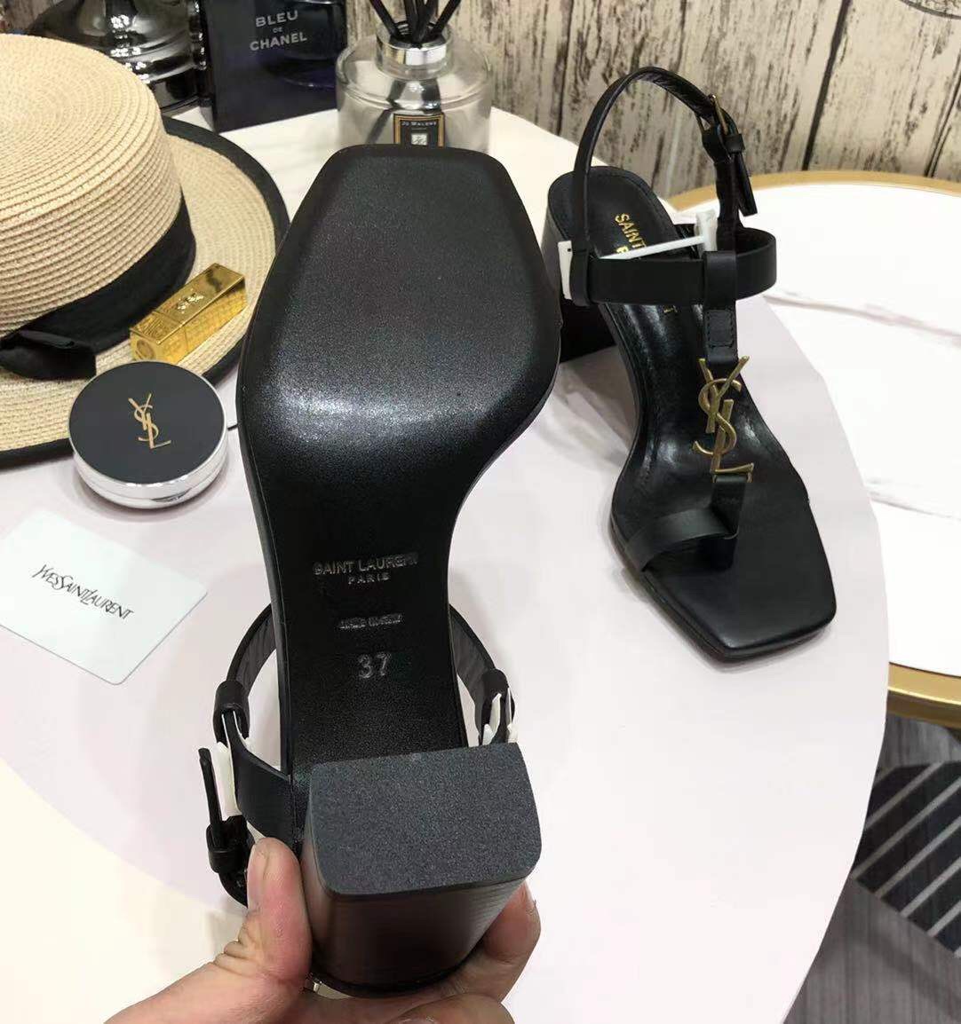 Saint Laurent Cassandra Heeled Sandals In Smooth Leather With Gold-Tone Monogram - FashionPlug