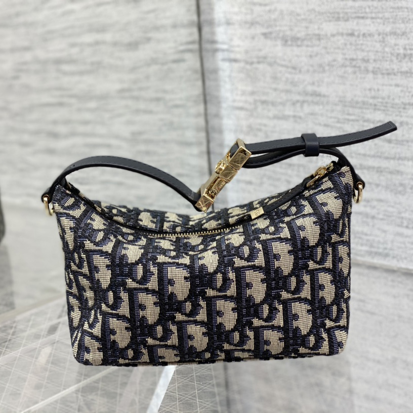 Dior Small Diortravel Nomad Pouch - FashionPlug