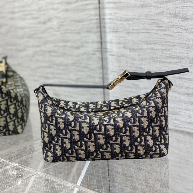 Dior Medium Diortravel Nomad Pouch - FashionPlug