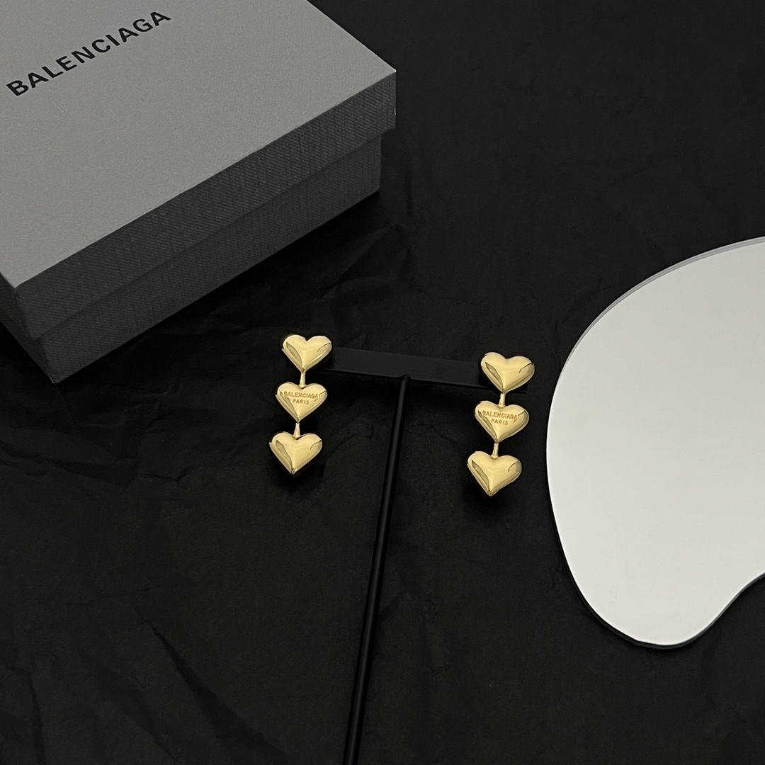 Balenciaga Women's Heart Earrings In Gold - FashionPlug