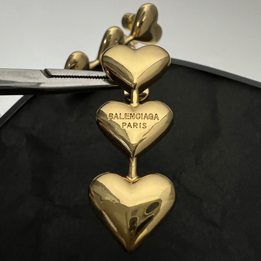 Balenciaga Women's Heart Earrings In Gold - FashionPlug