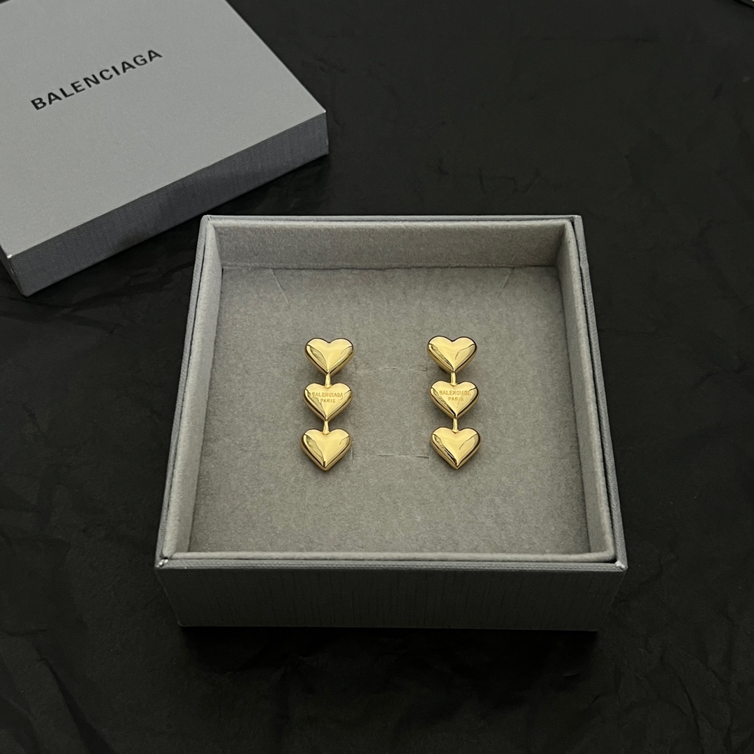 Balenciaga Women's Heart Earrings In Gold - FashionPlug