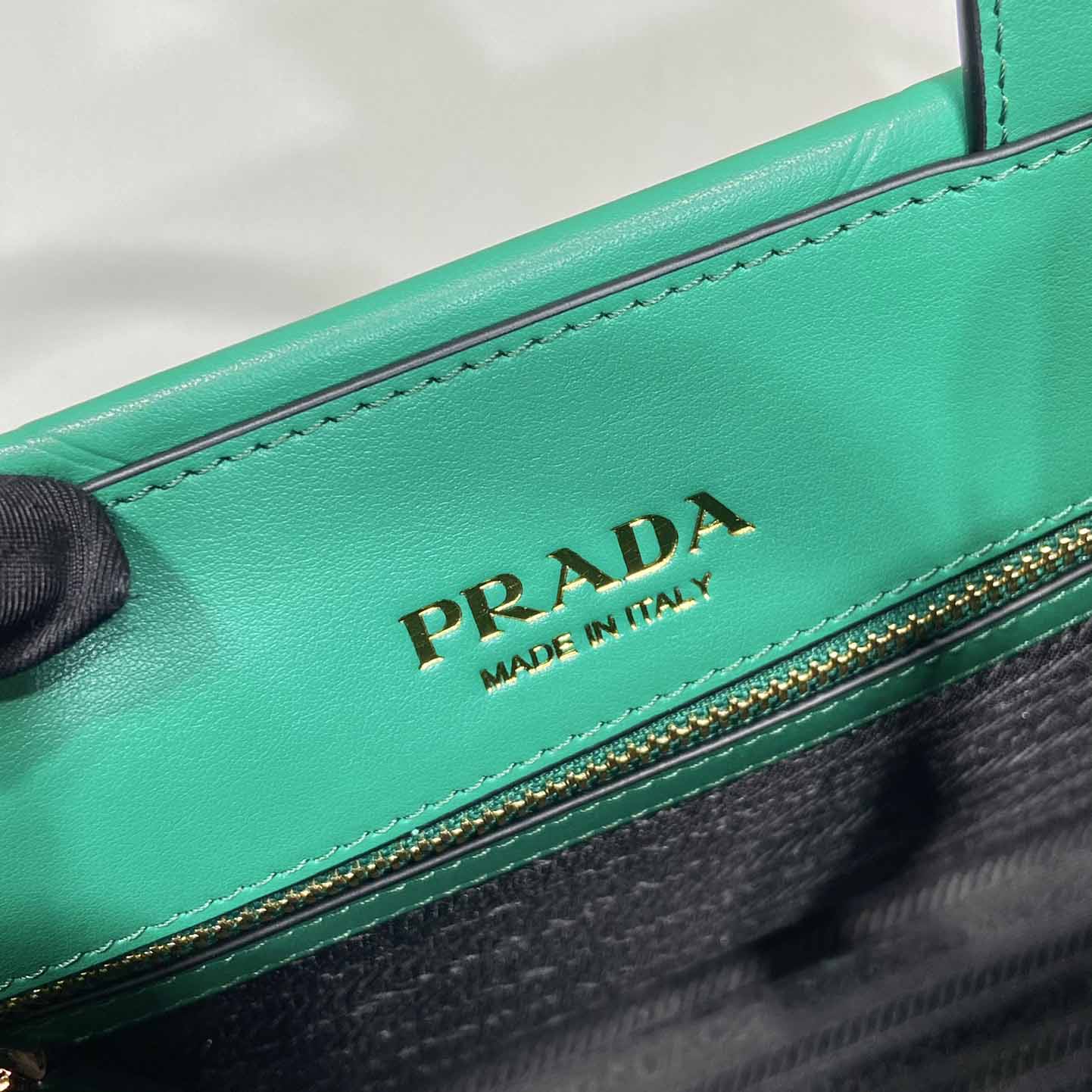 Prada Small Leather Prada Symbole Bag With Topstitching - FashionPlug