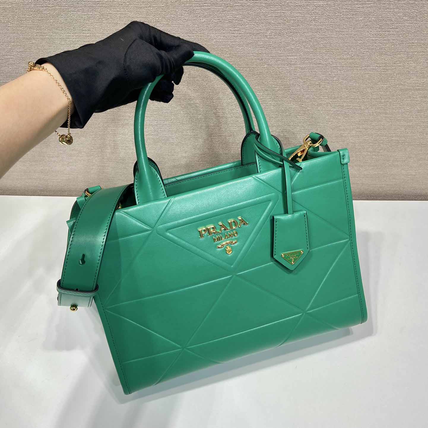 Prada Small Leather Prada Symbole Bag With Topstitching - FashionPlug