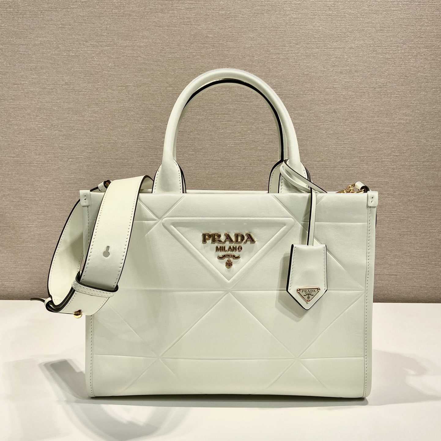 Prada Small Leather Prada Symbole Bag With Topstitching - FashionPlug