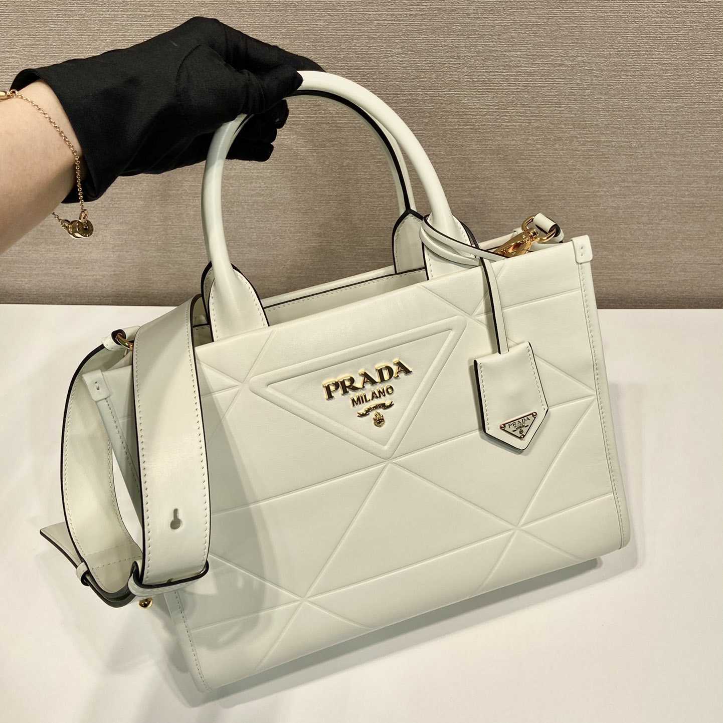 Prada Small Leather Prada Symbole Bag With Topstitching - FashionPlug