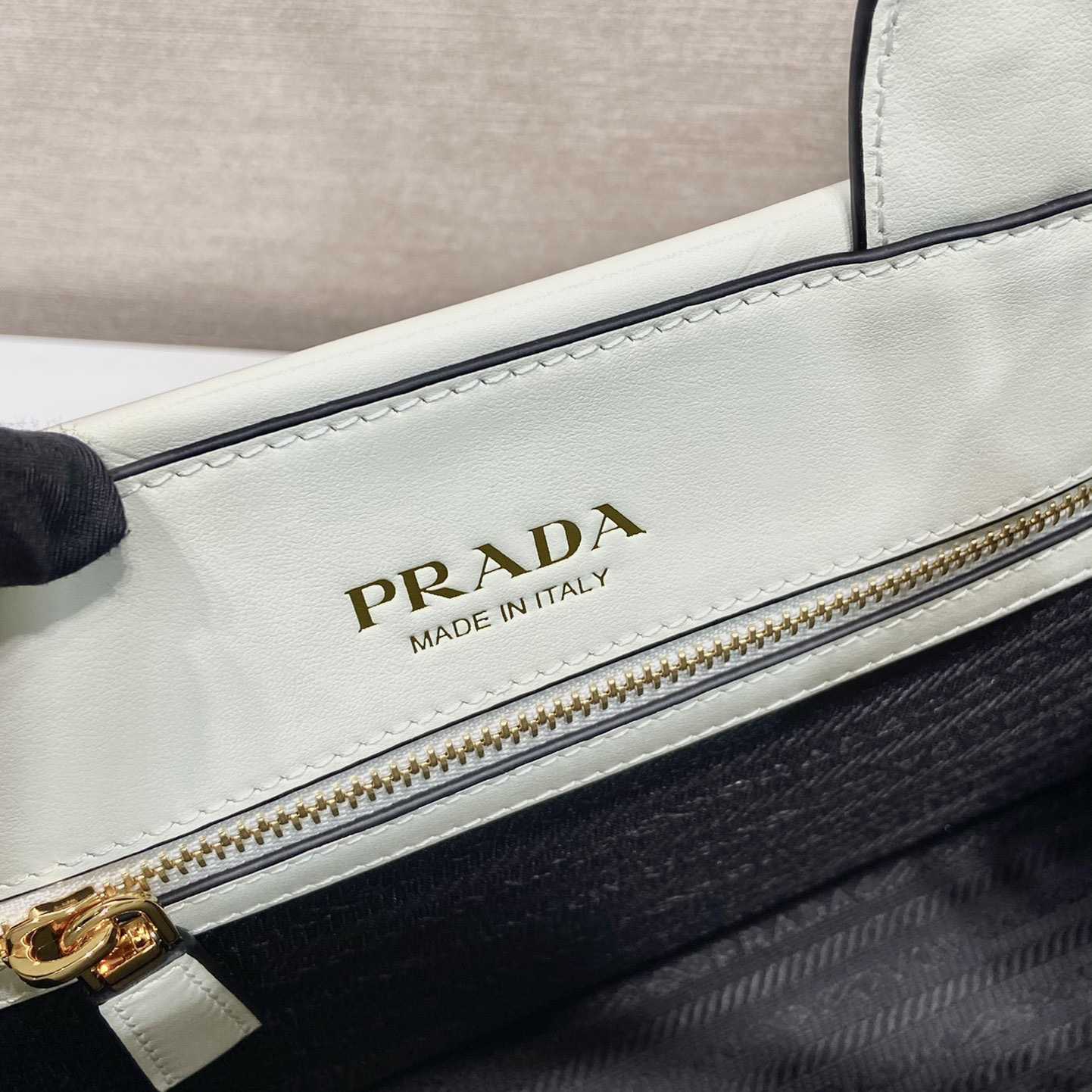 Prada Small Leather Prada Symbole Bag With Topstitching - FashionPlug