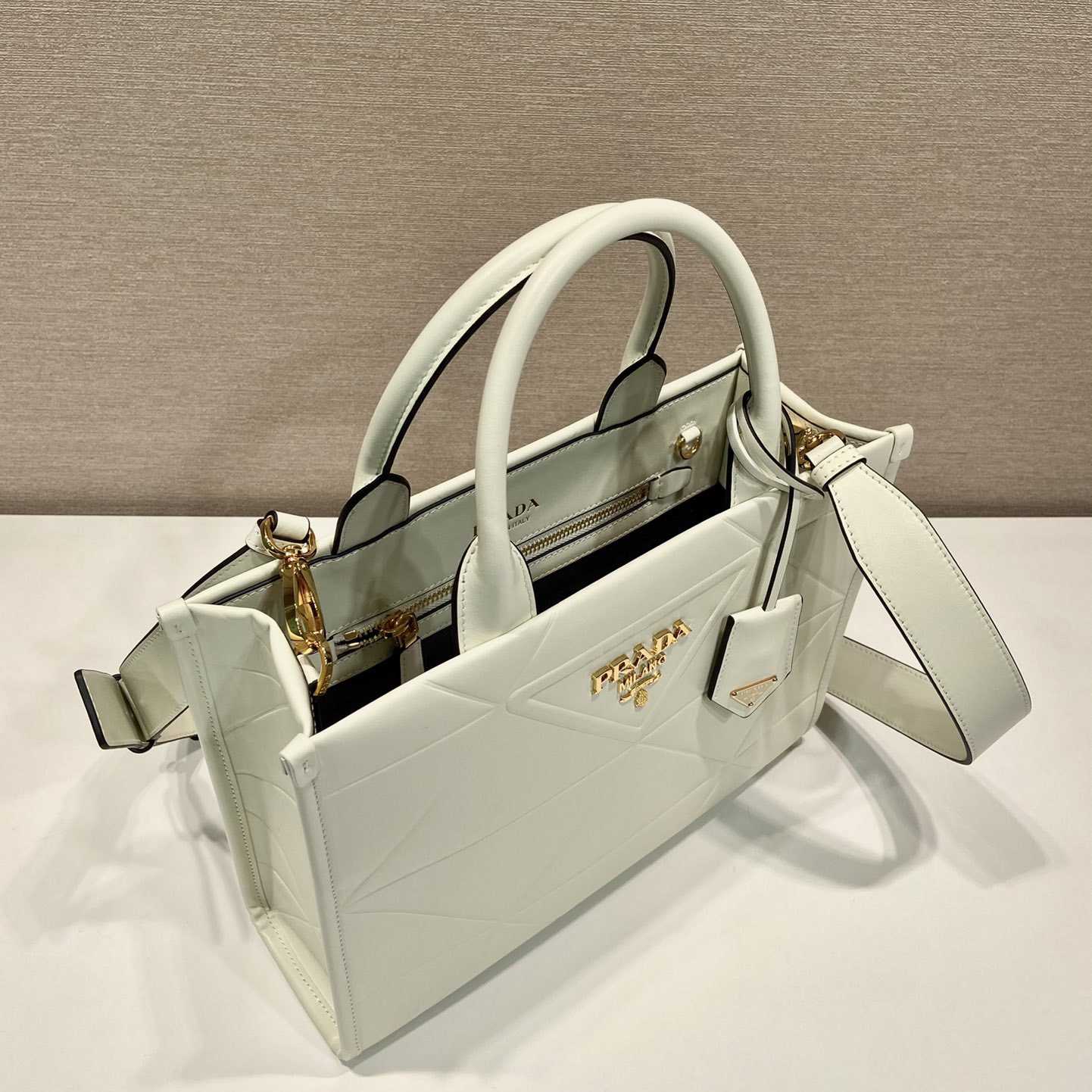 Prada Small Leather Prada Symbole Bag With Topstitching - FashionPlug