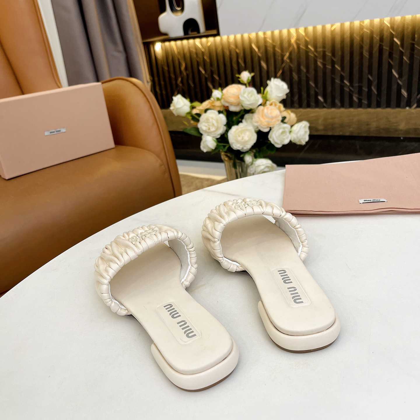 Miu Miu Matelassé Nappa Leather Slides - FashionPlug