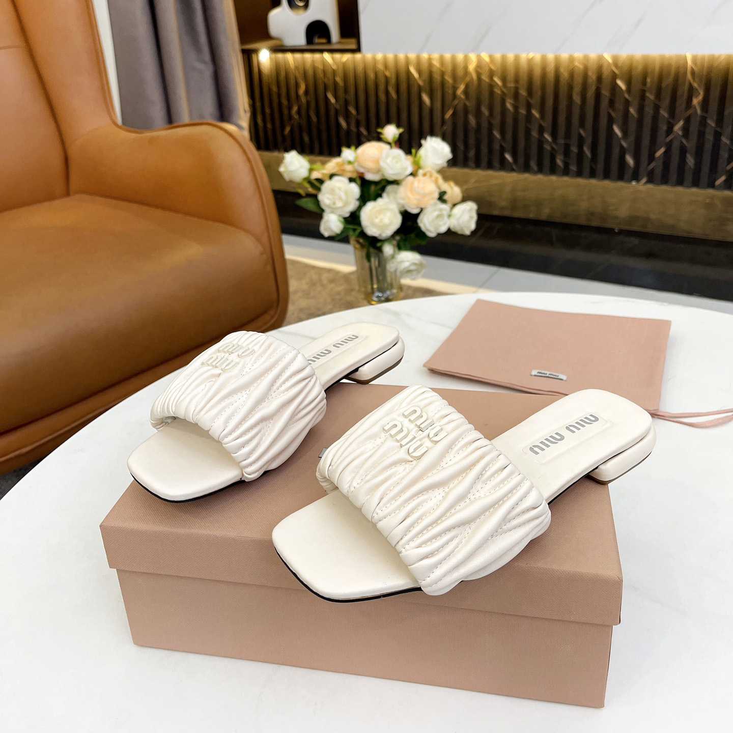 Miu Miu Matelassé Nappa Leather Slides - FashionPlug