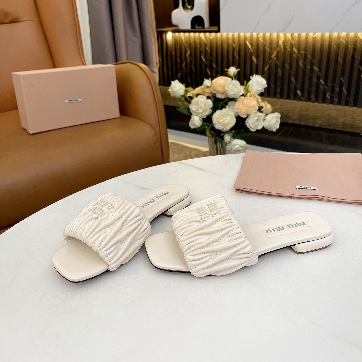 Miu Miu Matelassé Nappa Leather Slides - FashionPlug