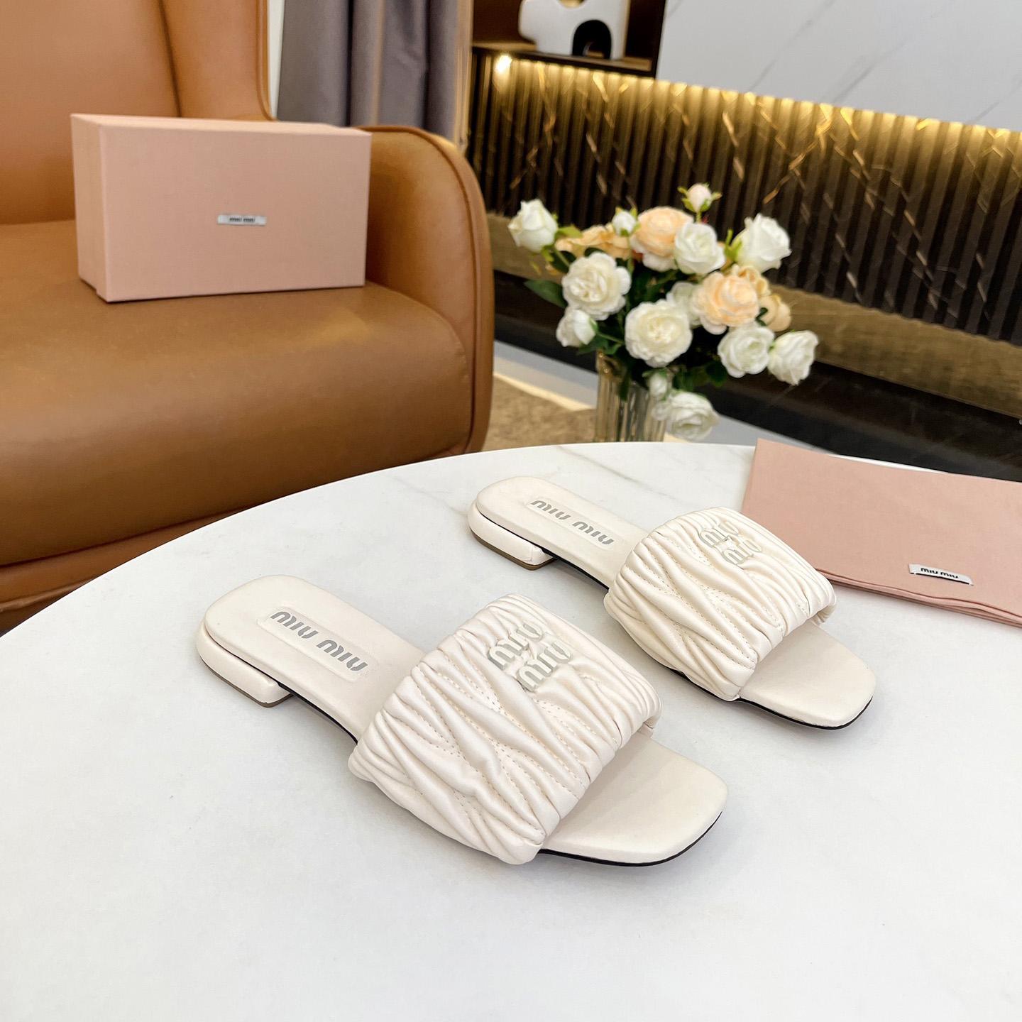Miu Miu Matelassé Nappa Leather Slides - FashionPlug