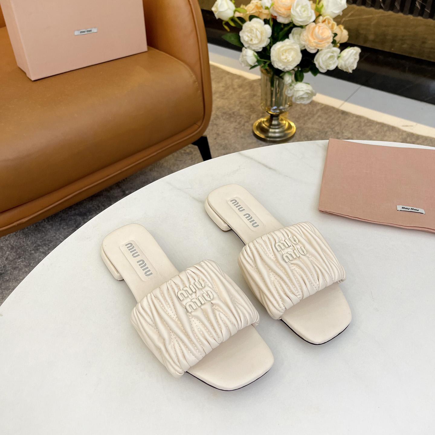 Miu Miu Matelassé Nappa Leather Slides - FashionPlug