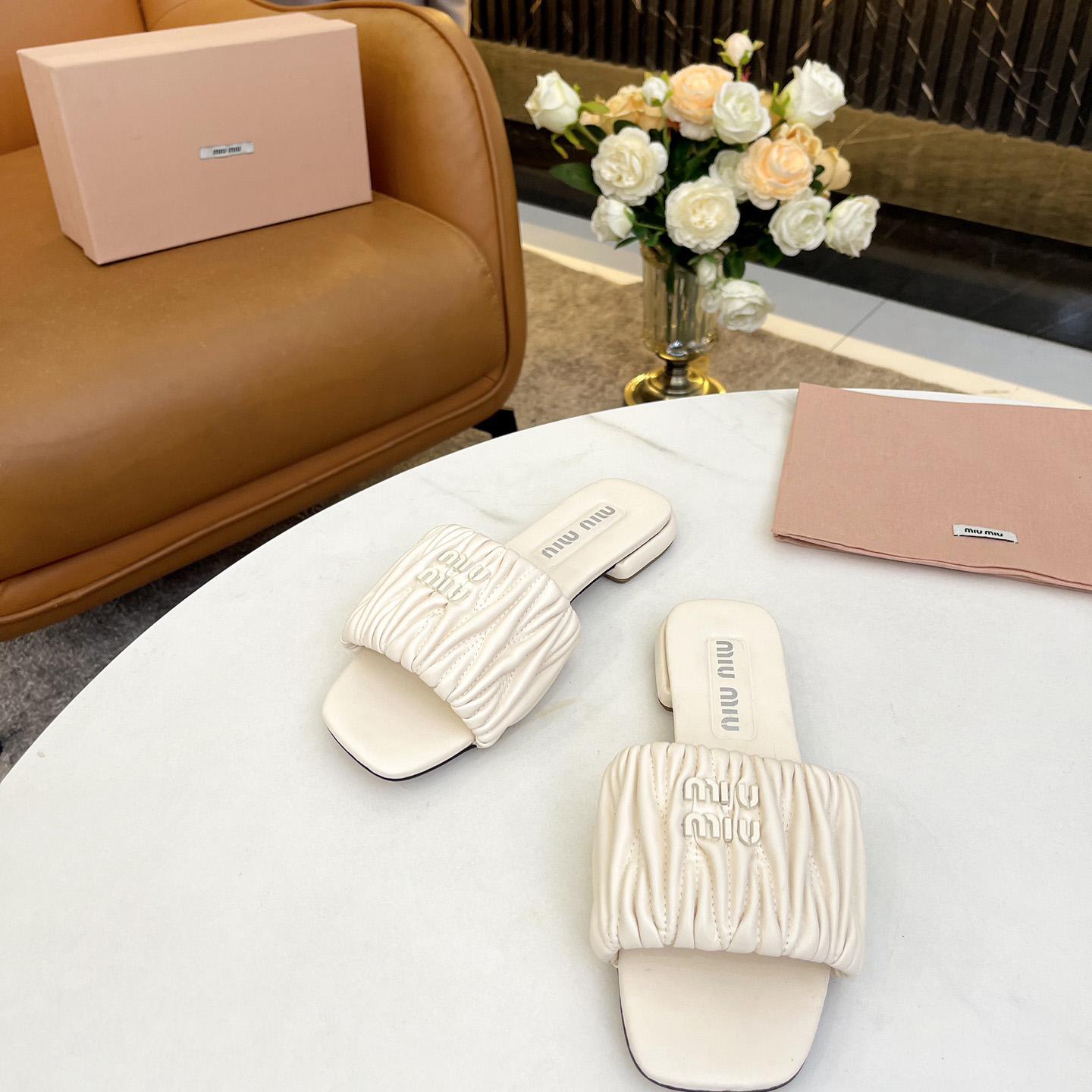 Miu Miu Matelassé Nappa Leather Slides - FashionPlug