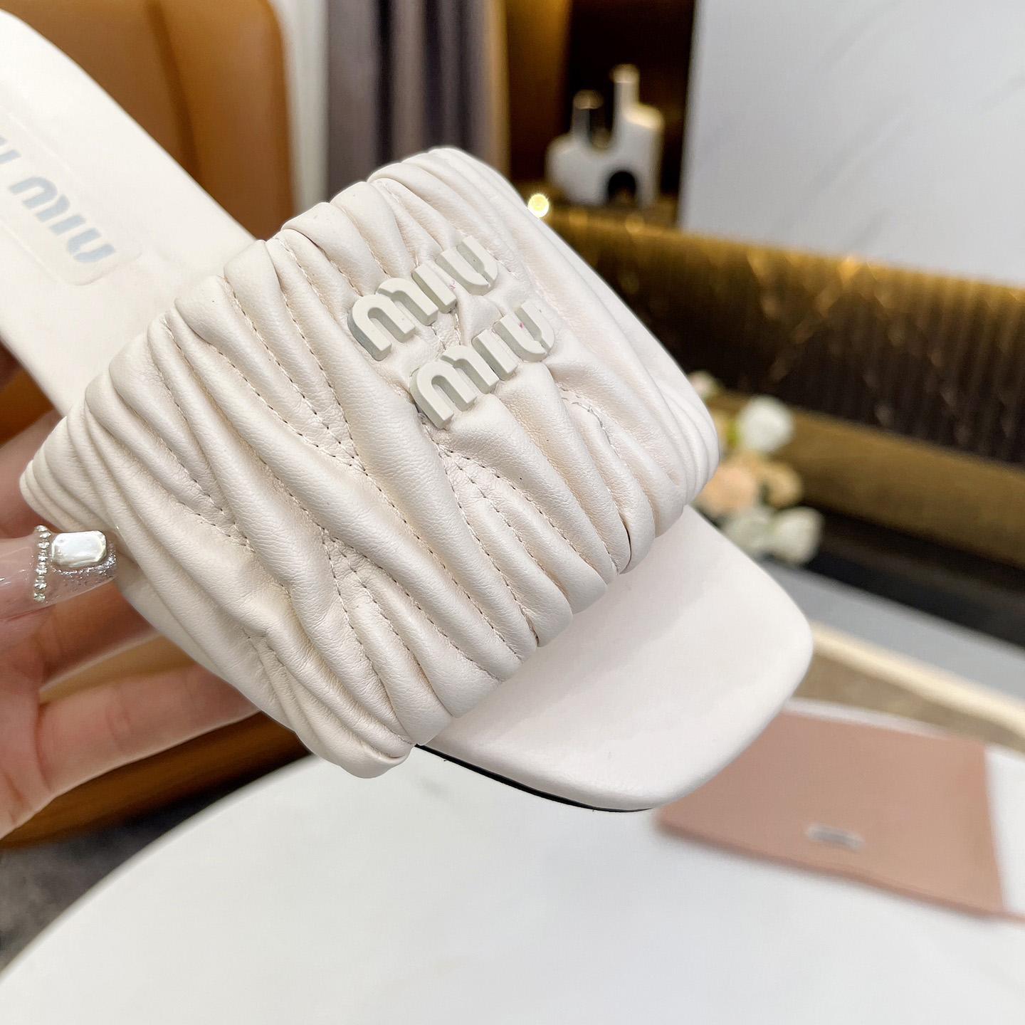 Miu Miu Matelassé Nappa Leather Slides - FashionPlug
