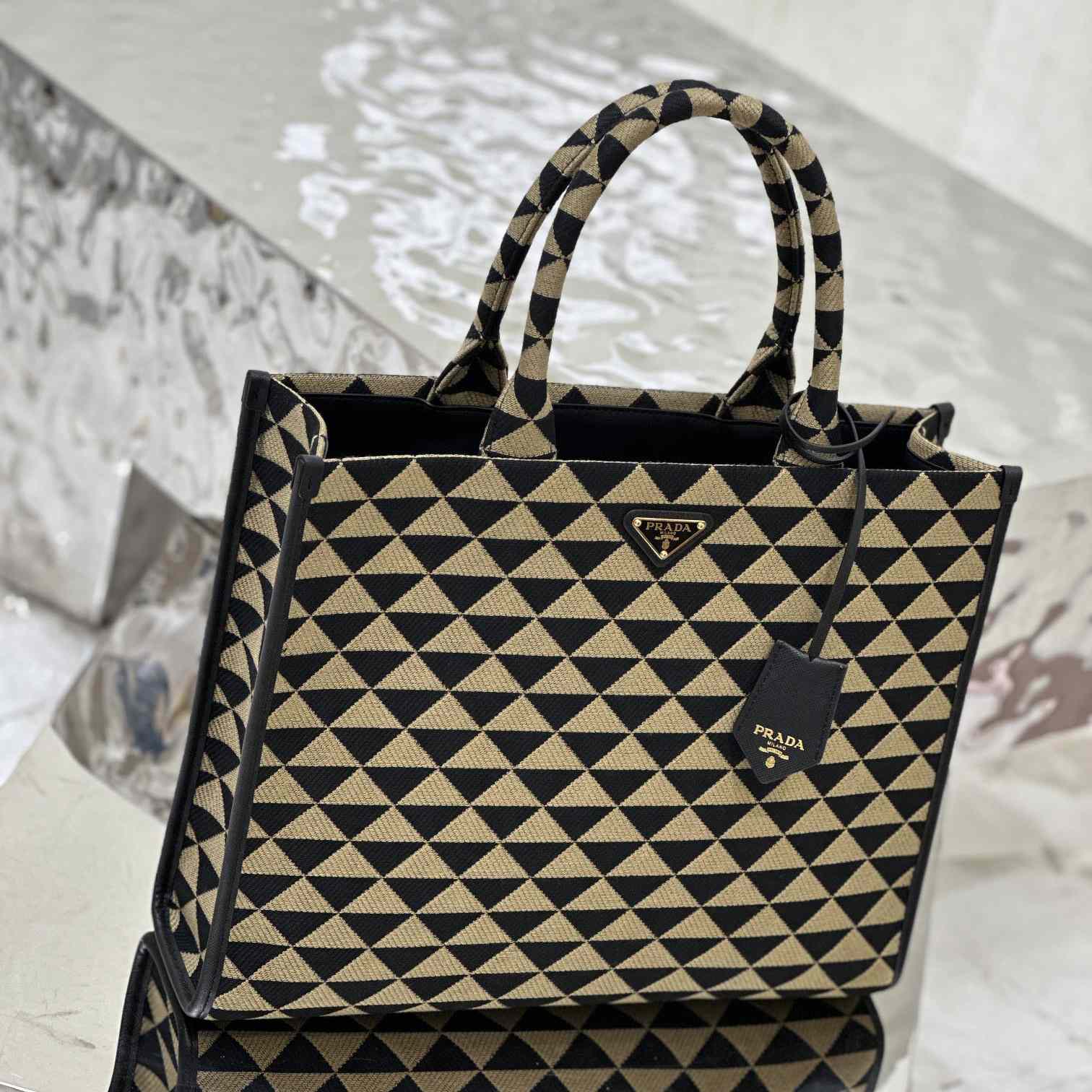 Prada Large Prada Symbole Embroidered Fabric Handbag - FashionPlug