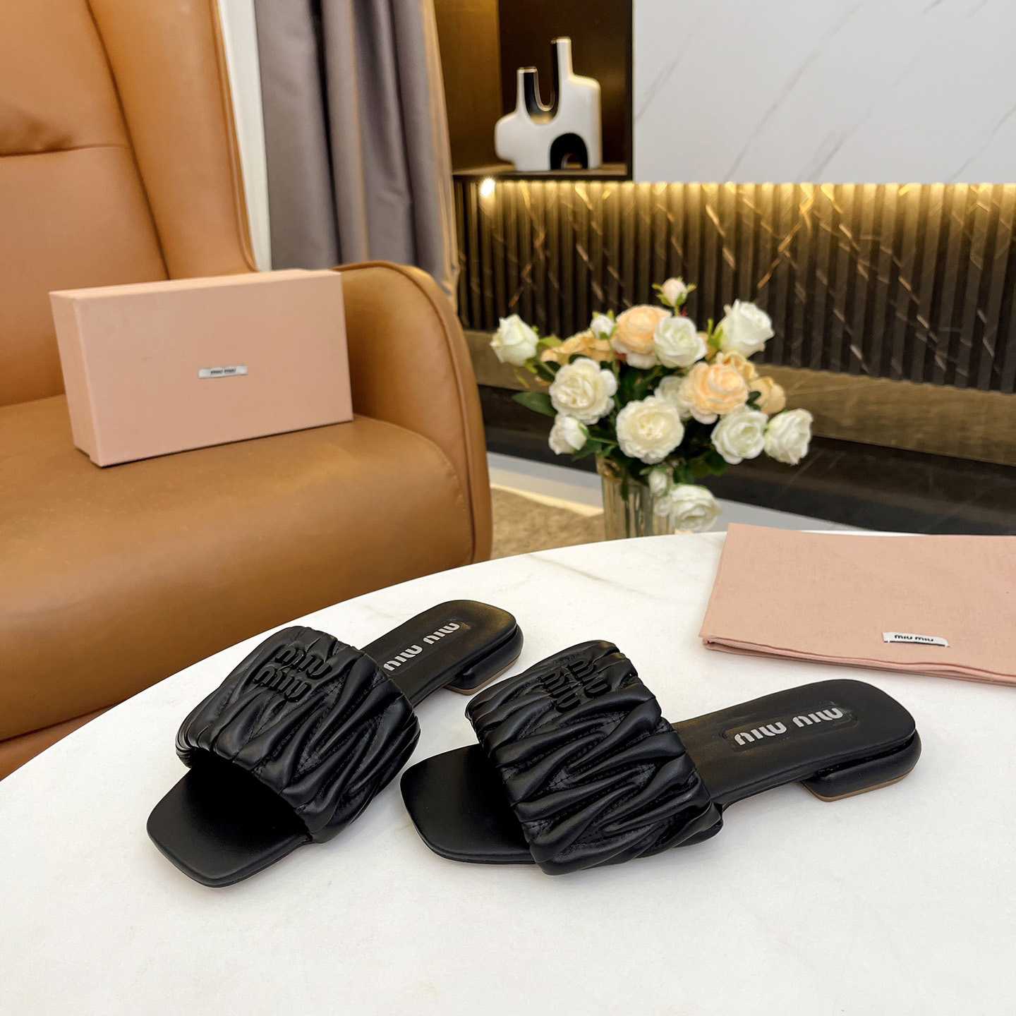 Miu Miu Matelassé Nappa Leather Slides - FashionPlug