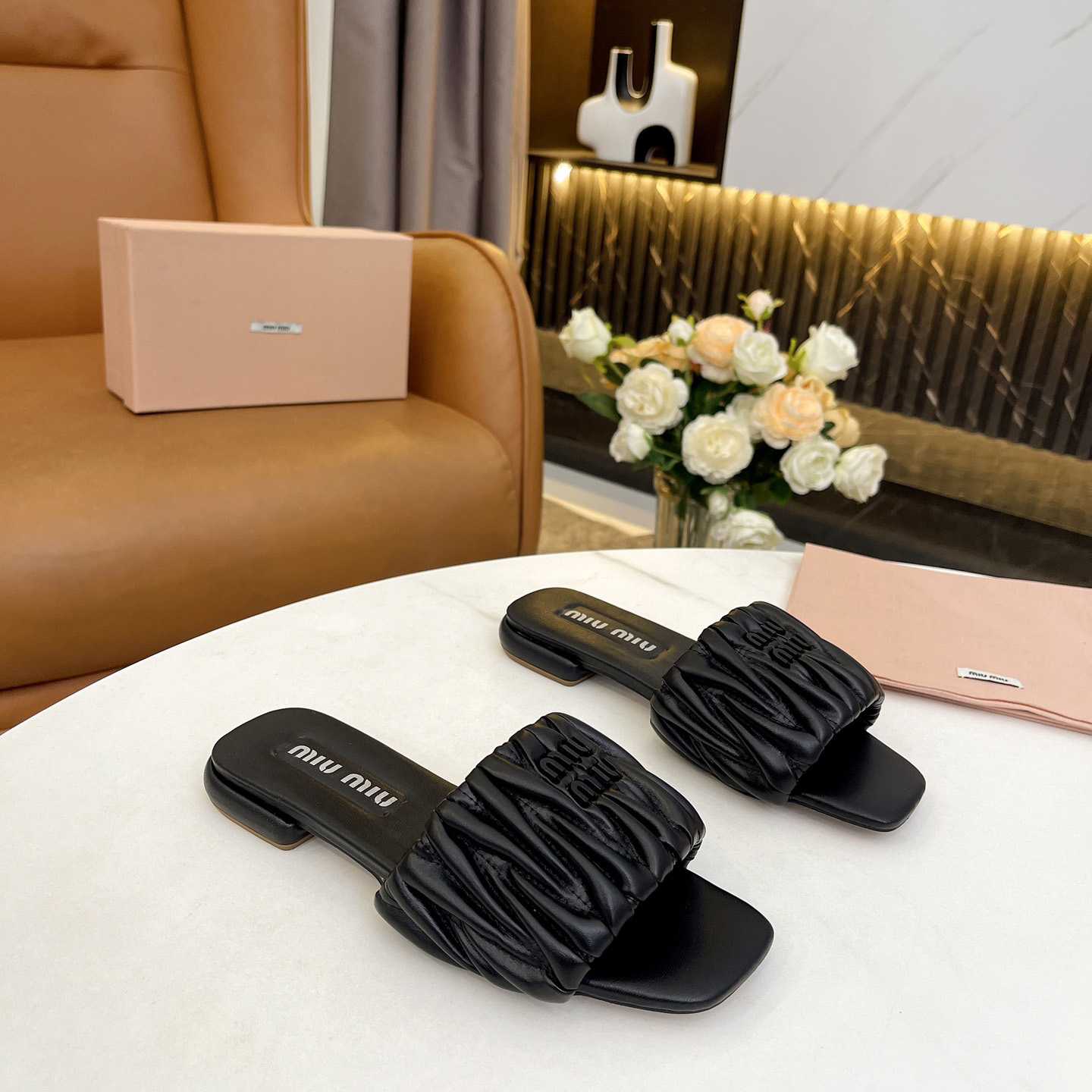 Miu Miu Matelassé Nappa Leather Slides - FashionPlug