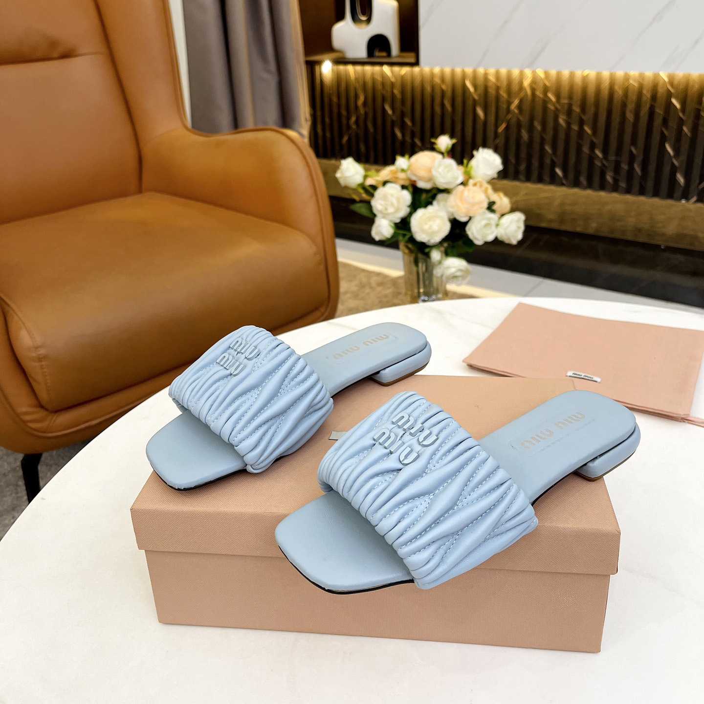 Miu Miu Matelassé Nappa Leather Slides - FashionPlug
