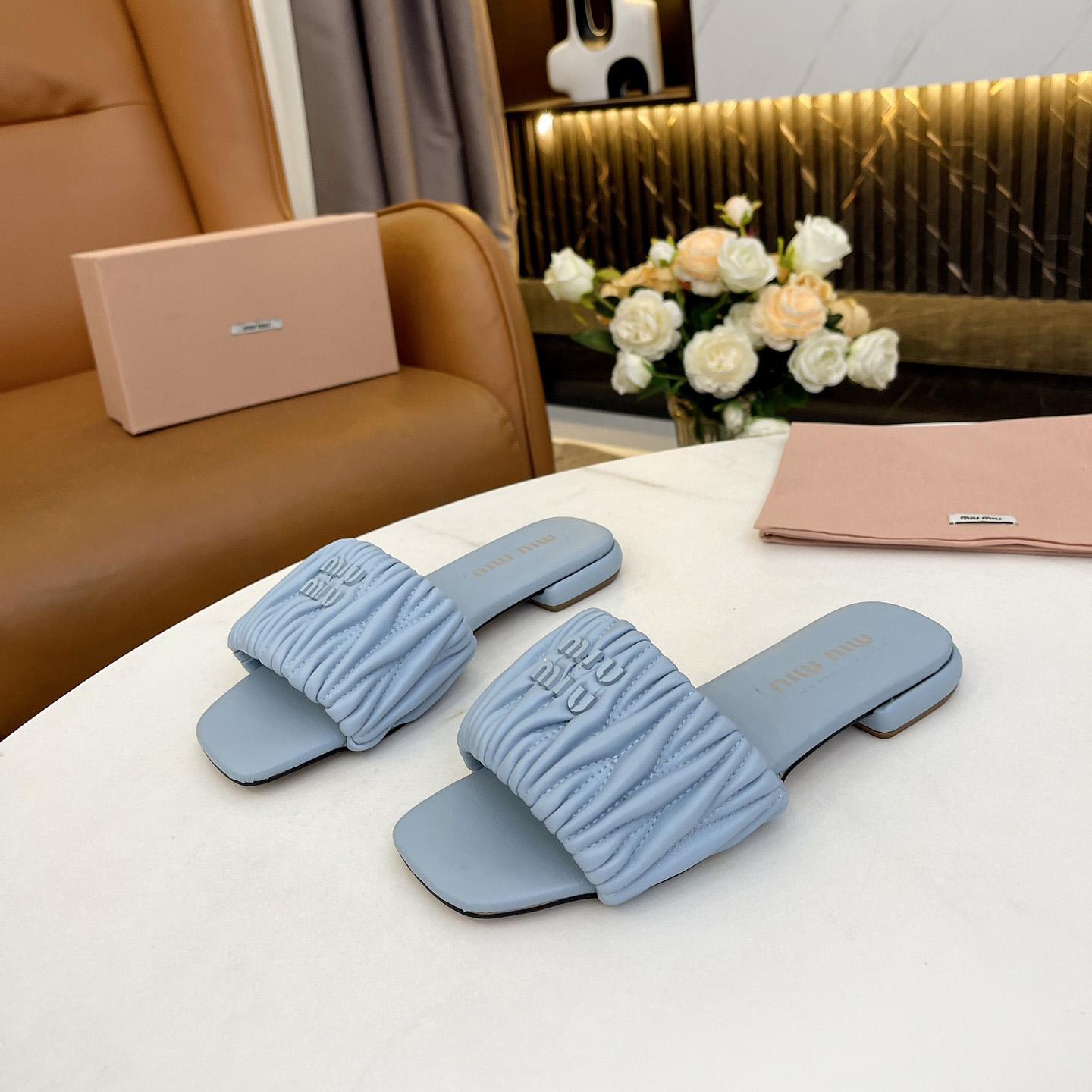 Miu Miu Matelassé Nappa Leather Slides - FashionPlug