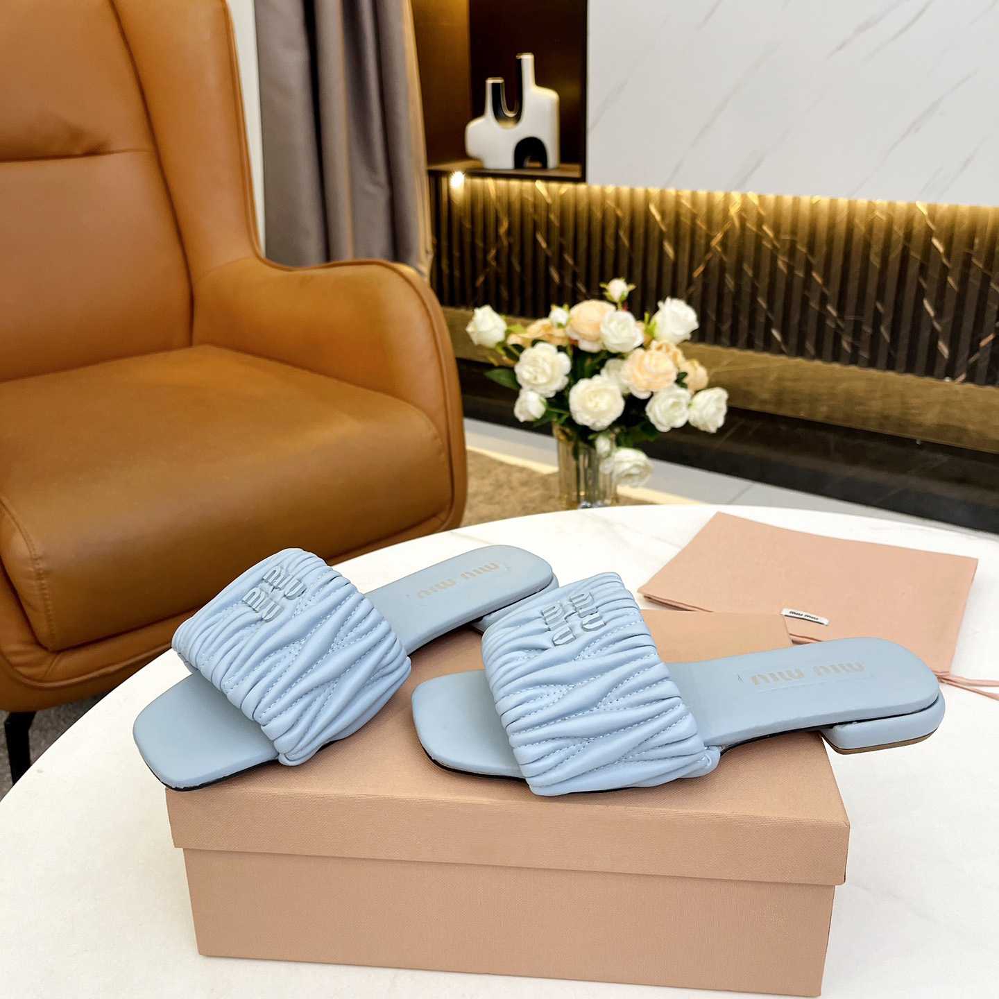 Miu Miu Matelassé Nappa Leather Slides - FashionPlug