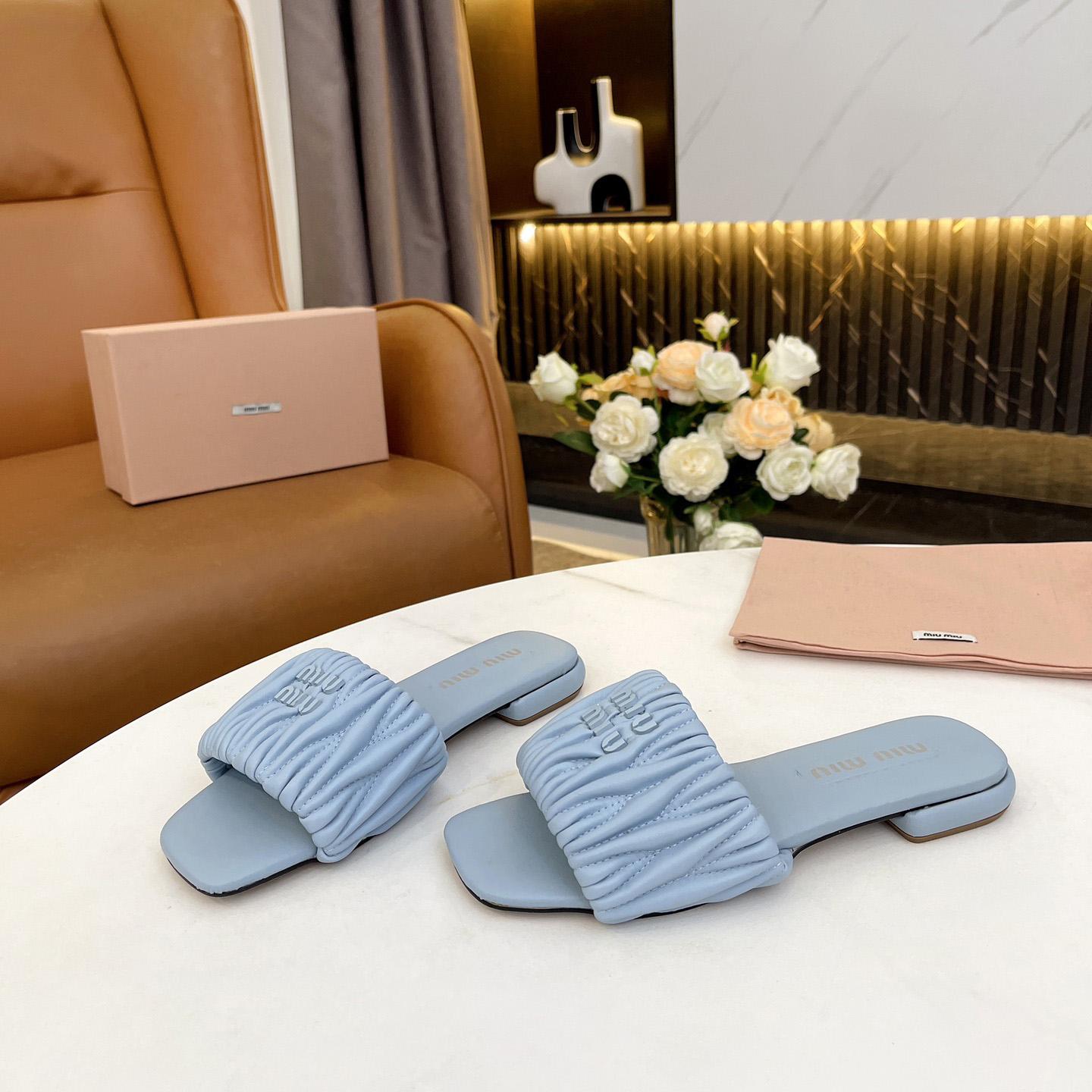 Miu Miu Matelassé Nappa Leather Slides - FashionPlug