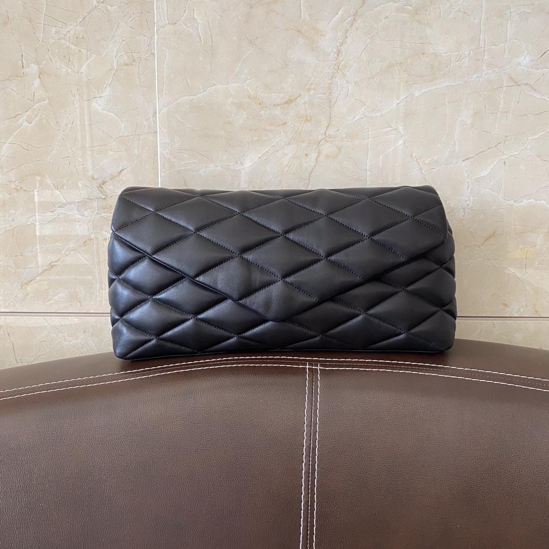 Saint Laurent Sade Puffer Quilted Leather Clutch In Black  - FashionPlug