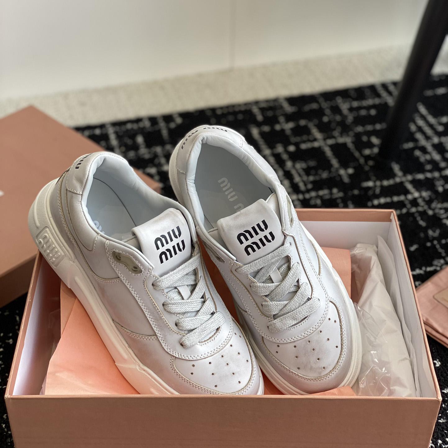 Miu Miu Bleached Leather Sneakers - FashionPlug