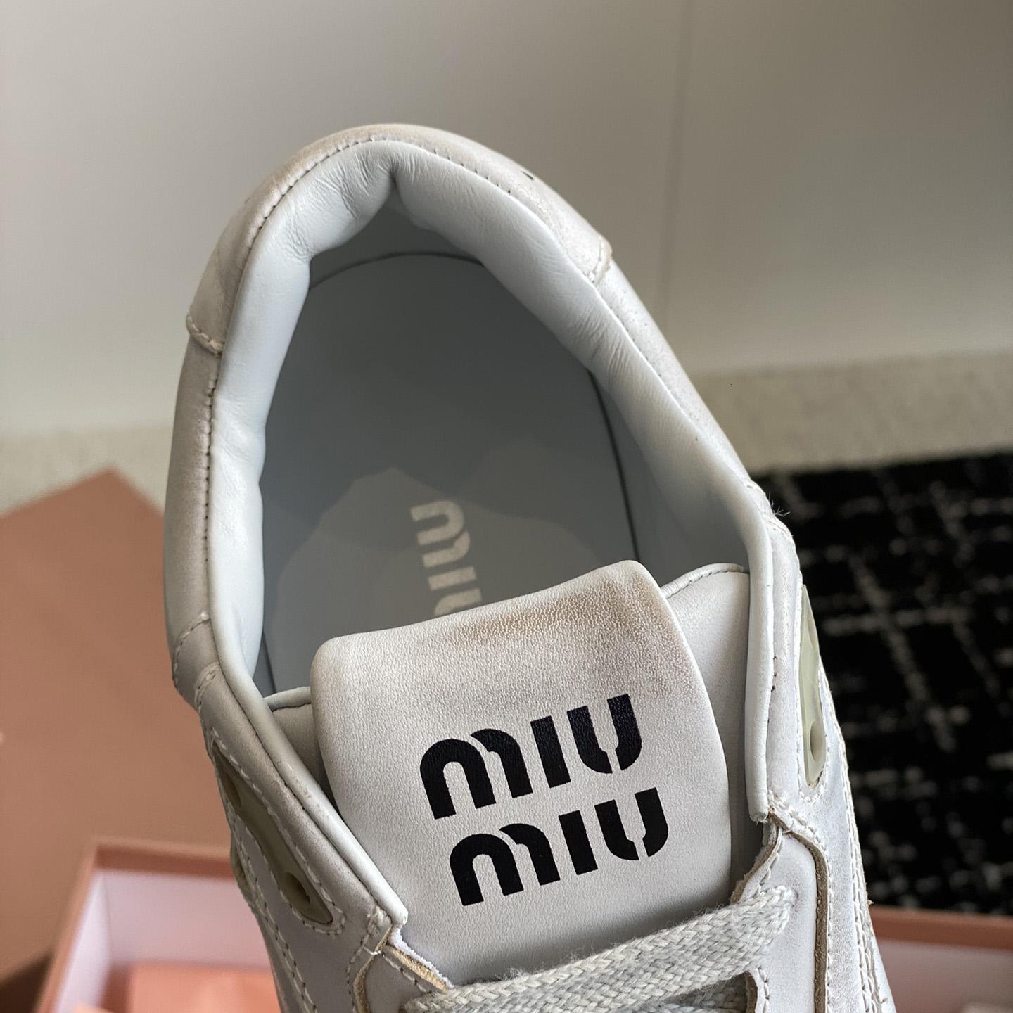 Miu Miu Bleached Leather Sneakers - FashionPlug