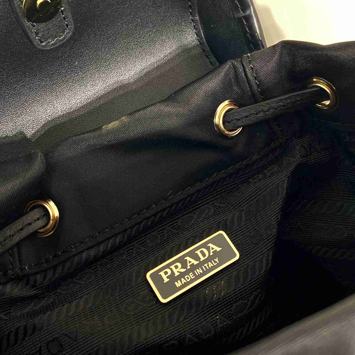 Prada Small Re-Nylon And Brushed Leather Backpack - FashionPlug