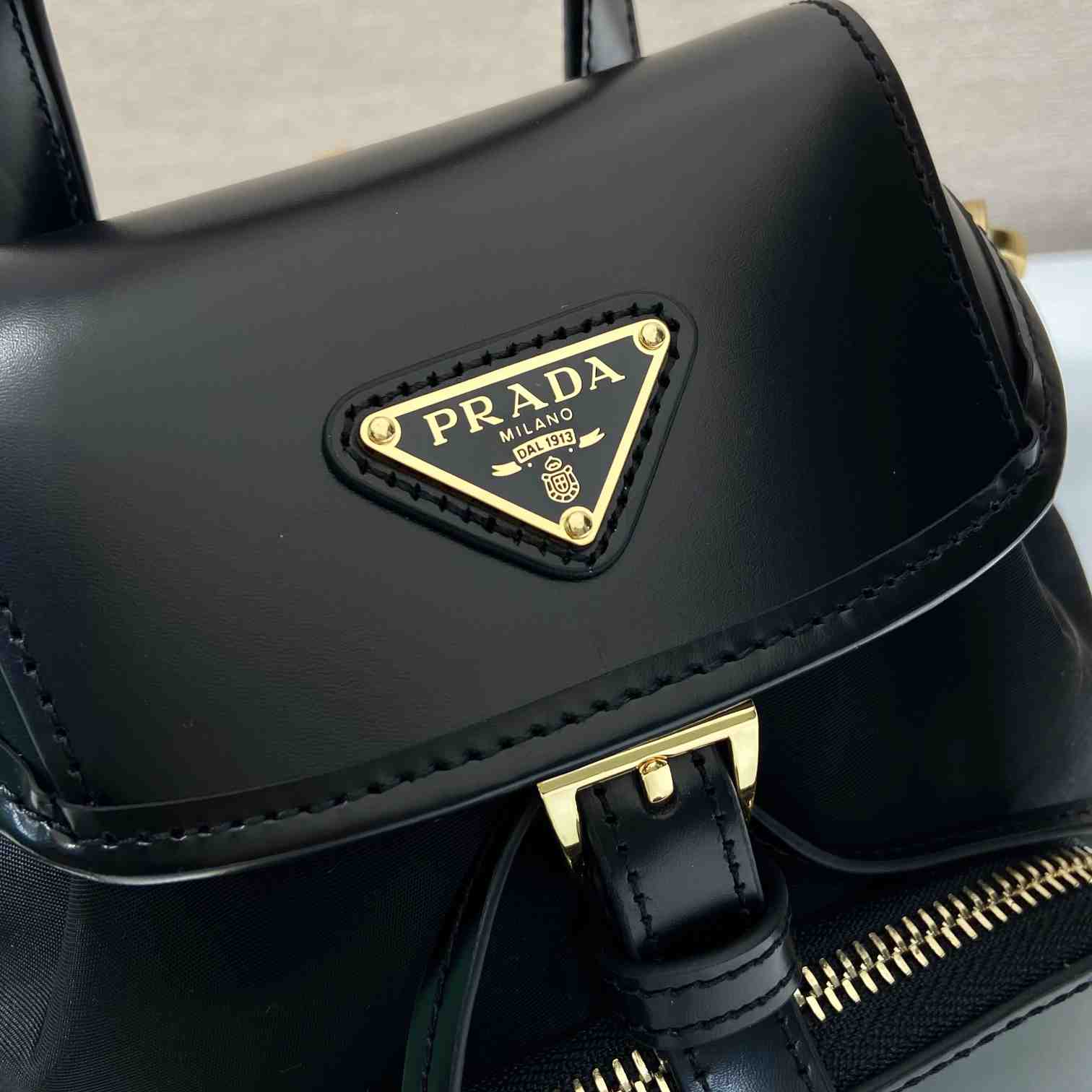 Prada Small Re-Nylon And Brushed Leather Backpack - FashionPlug