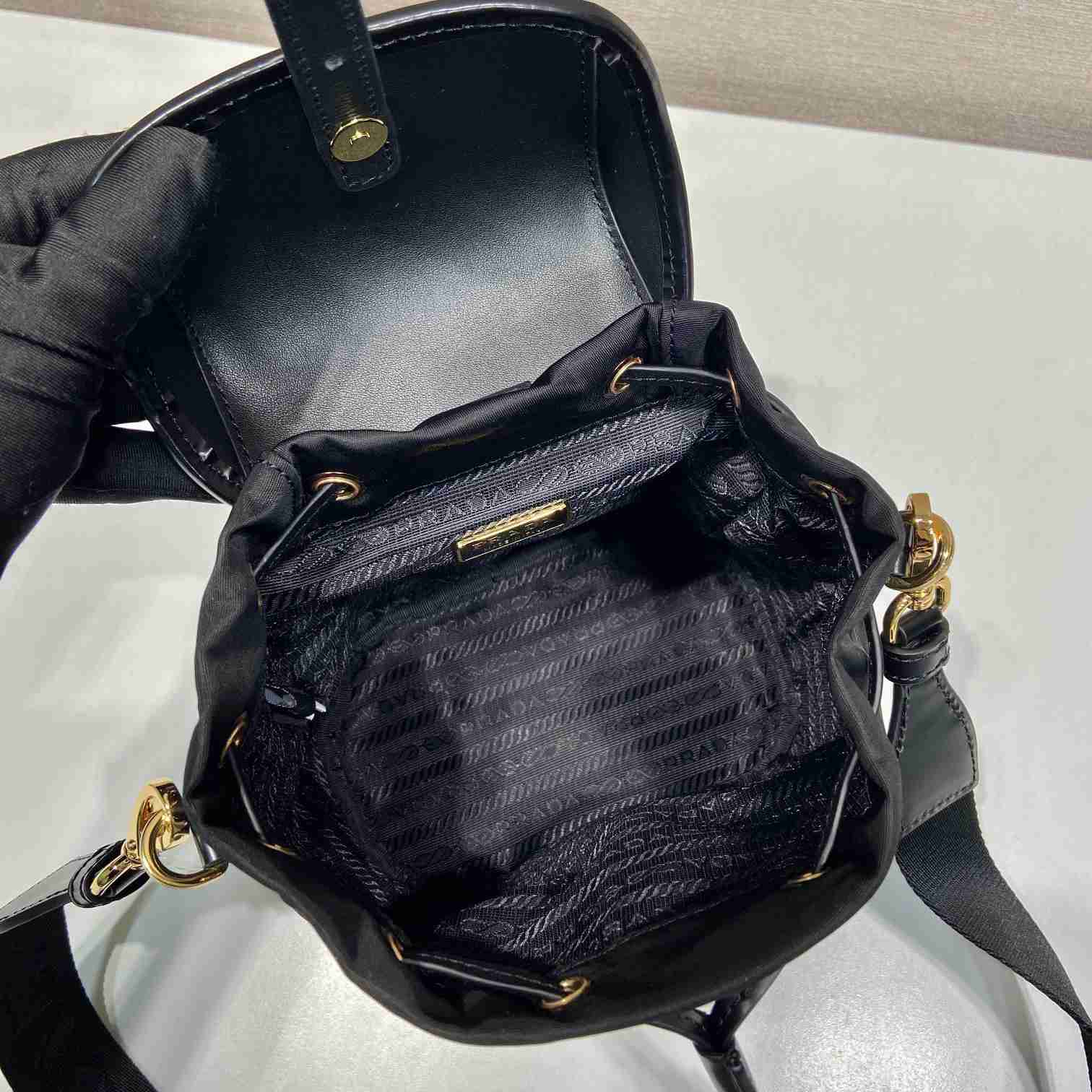 Prada Small Re-Nylon And Brushed Leather Backpack - FashionPlug