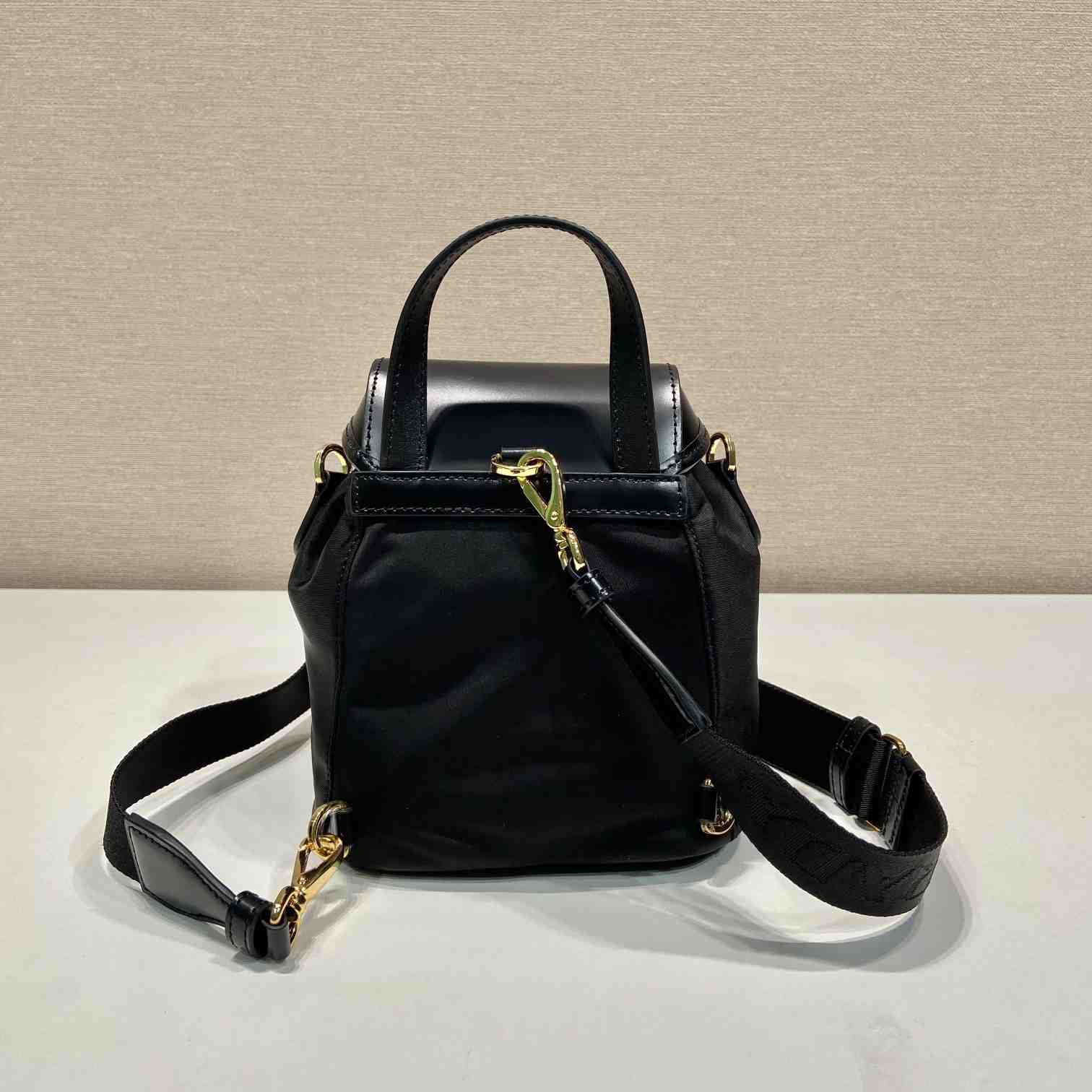 Prada Small Re-Nylon And Brushed Leather Backpack - FashionPlug