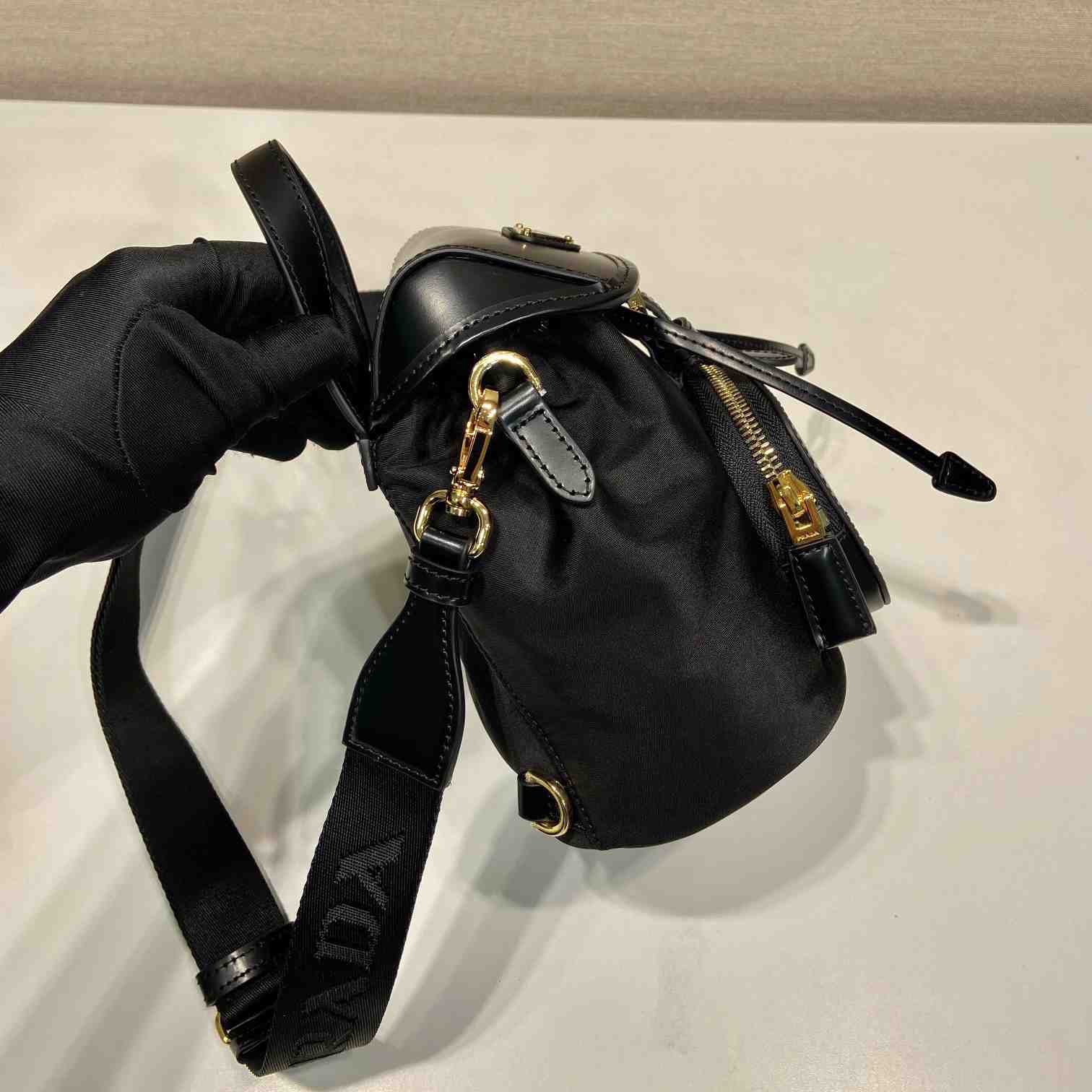 Prada Small Re-Nylon And Brushed Leather Backpack - FashionPlug