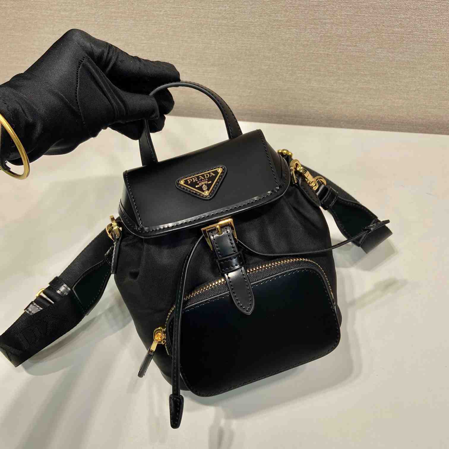 Prada Small Re-Nylon And Brushed Leather Backpack - FashionPlug