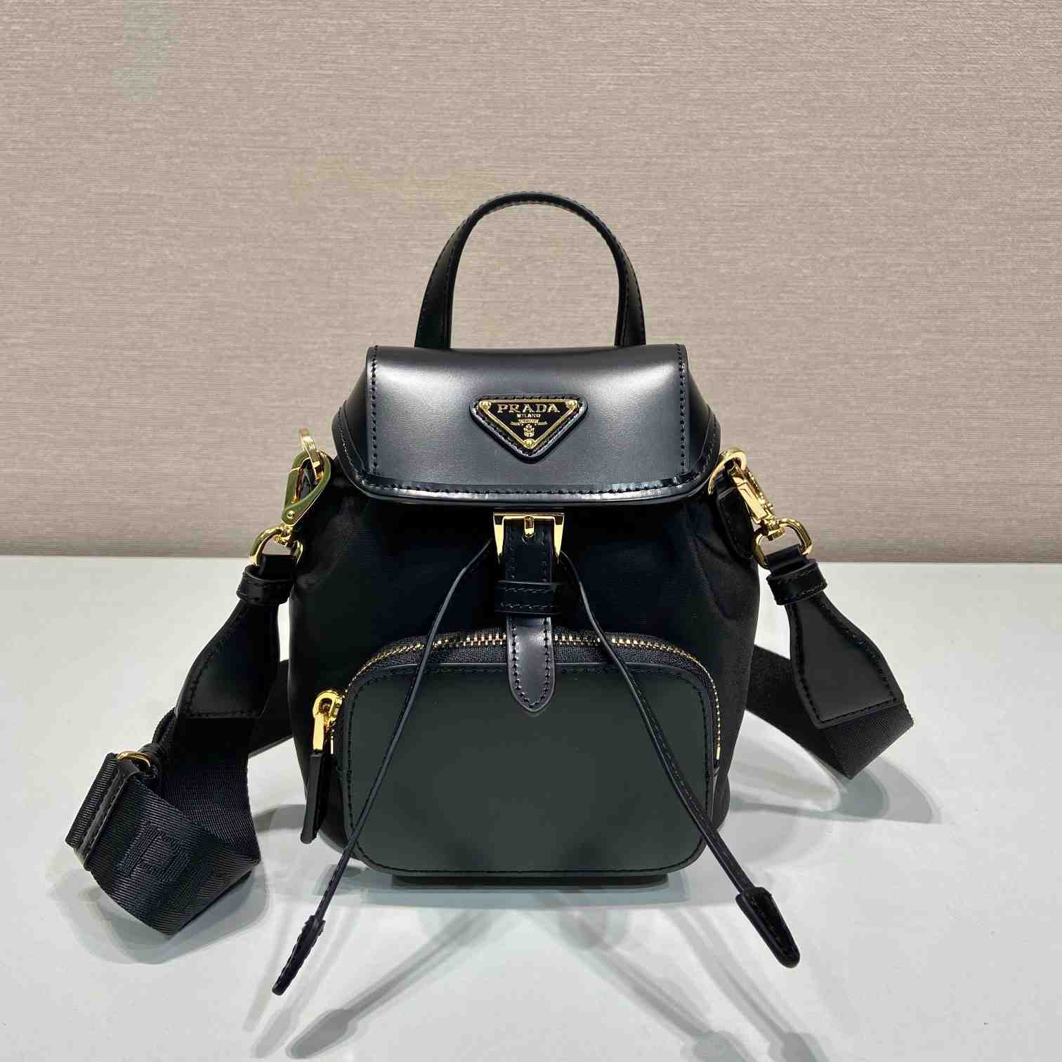 Prada Small Re-Nylon And Brushed Leather Backpack - FashionPlug