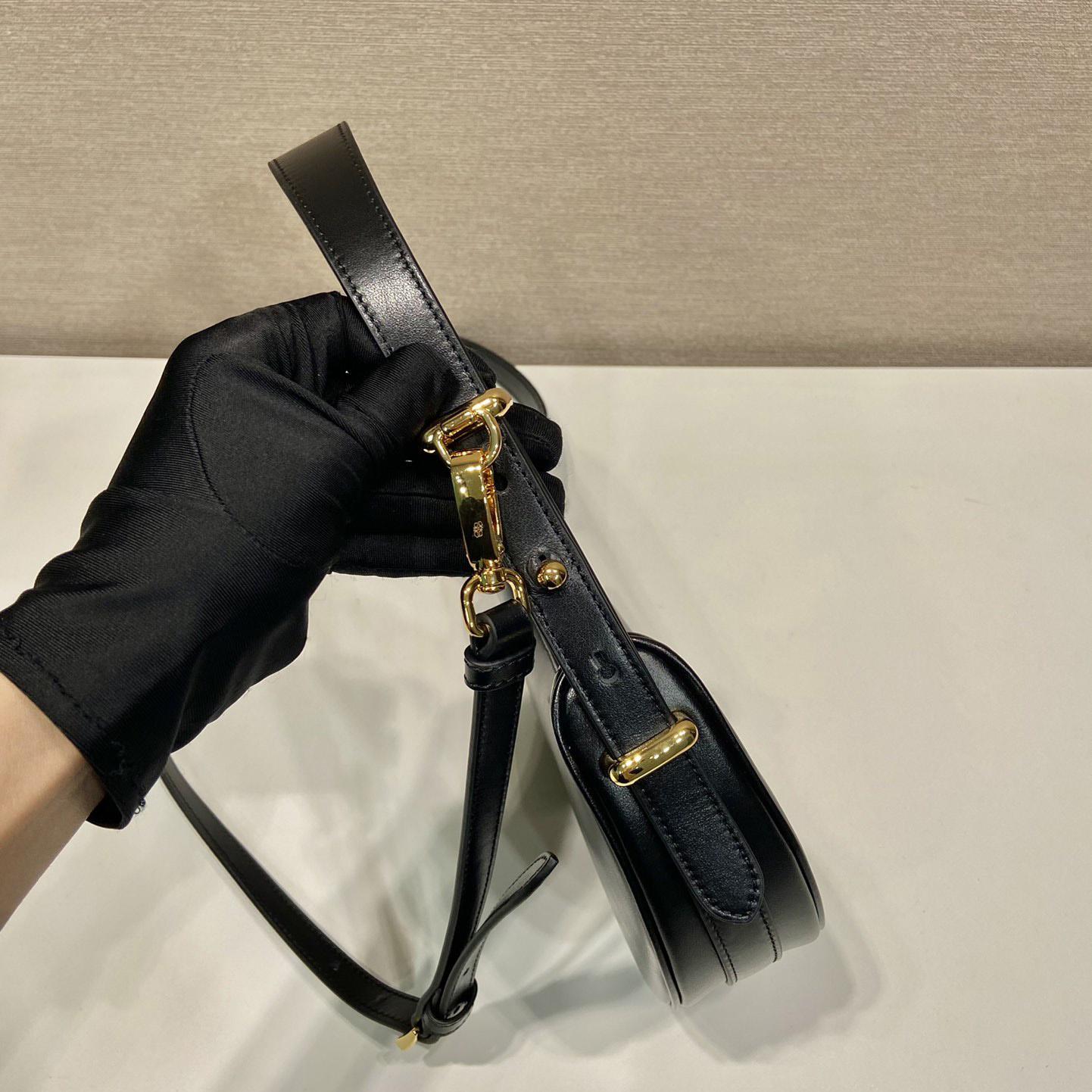 Prada Arqué Leather Mini Shoulder Bag - FashionPlug
